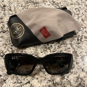 Ray-Ban sunglasses.